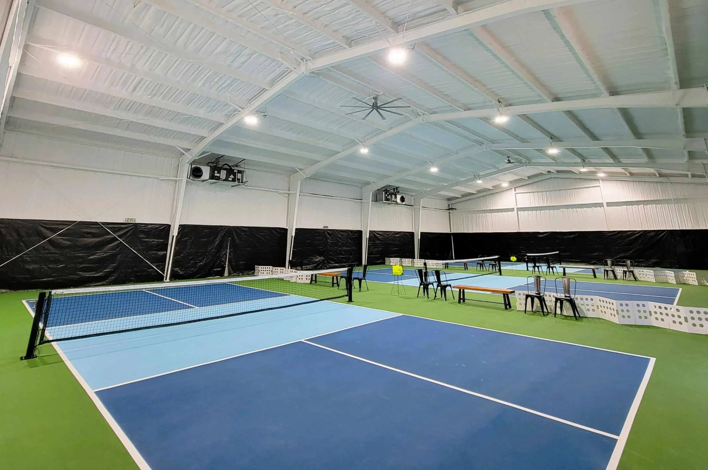 An empty indoor court, lines freshly painted